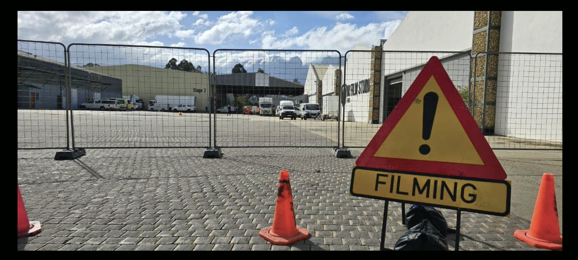 Filming signage at studio entrance